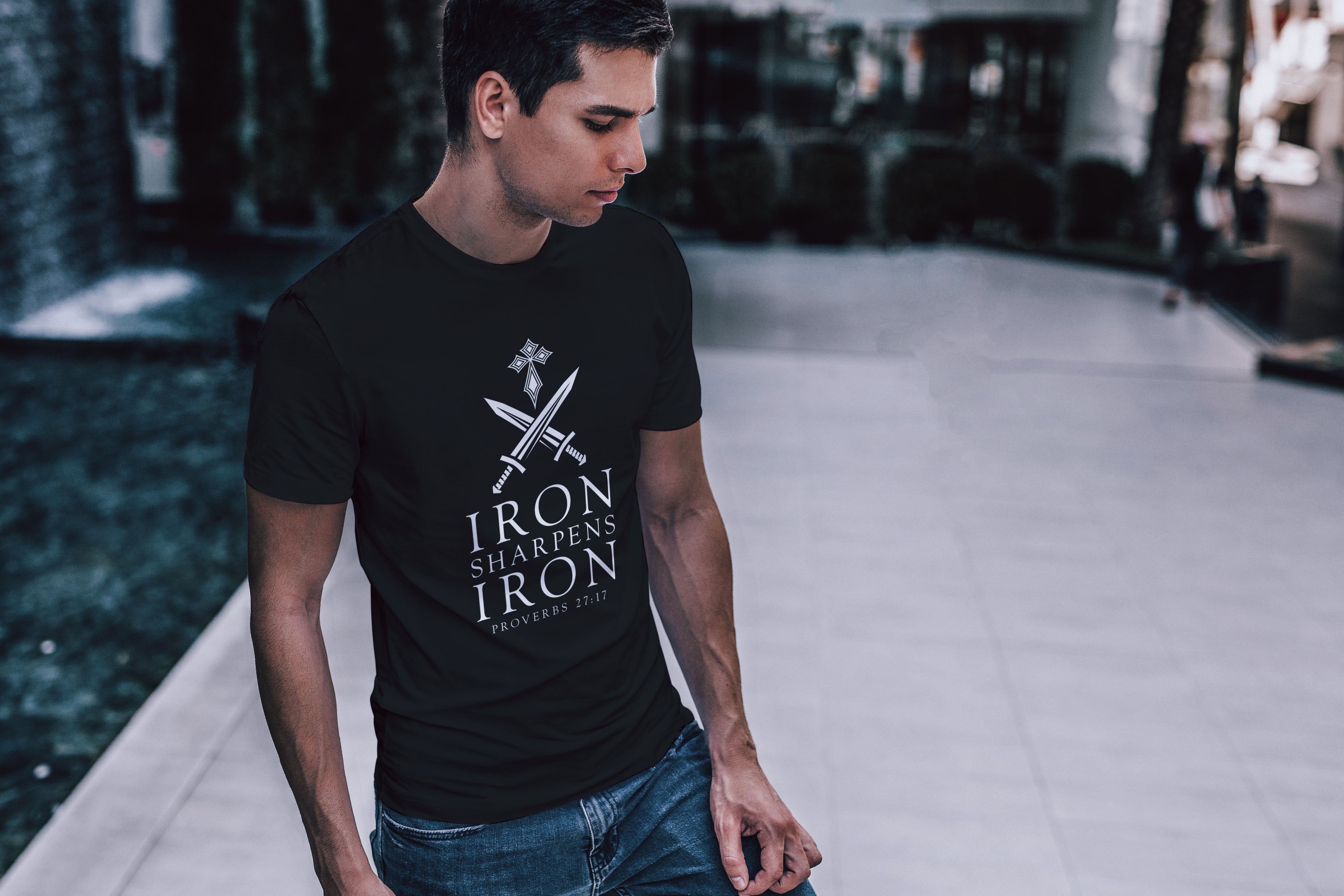 Man wearing Iron Sharpens Iron Christian T-shirt outdoors

